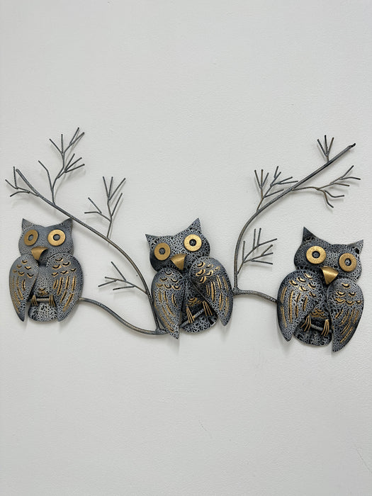 Front view of three crackle-effect metal owls on a branch, hand painted with gold detailing.