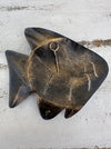 Back of turquoise metal fish wall art showing hanging point