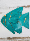 Front view of turquoise metal fish wall art showing crackle texture and gold accents
