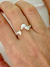 cute  puppy adjustable ring on a person's finger 