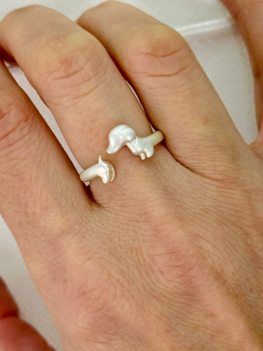 cute  puppy adjustable ring on a person's finger 