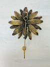 Back view of handmade daisy wall hook.