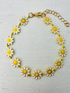 Daisy flower bracelet on a gold-tone chain, displayed on a white background.