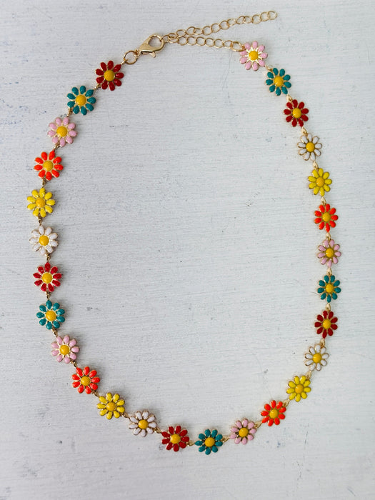 Colorful flower-shaped necklace on a light gray background