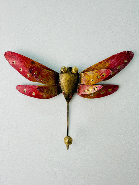 Handmade and hand painted metal dragonfly hook with red, yellow, and gold colors