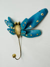 Handmade and hand painted metal wall hook in the shape of a dragonfly with turquoise color and gold accents