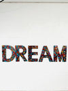 front view of mosaic DREAM on white wall