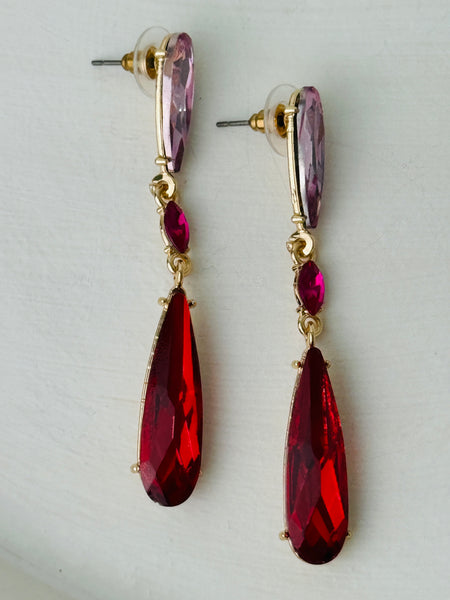Elegant 7 cm long drop earrings with amethyst-purple, ruby-red and deep-red  crystals in gold-tone finish.