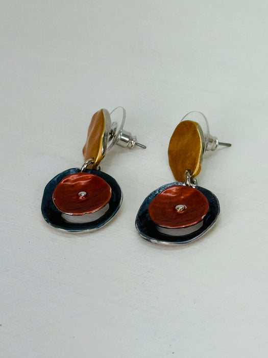 Drop earrings with layered circular enamel shapes in bronze, copper and navy on silver tone setting, displayed flat on white background