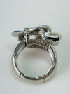Back view of adjustable enamel ring with elastic band in silver tone.