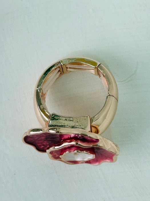 Rose gold ring with layered enamel flower in rose-gold.
