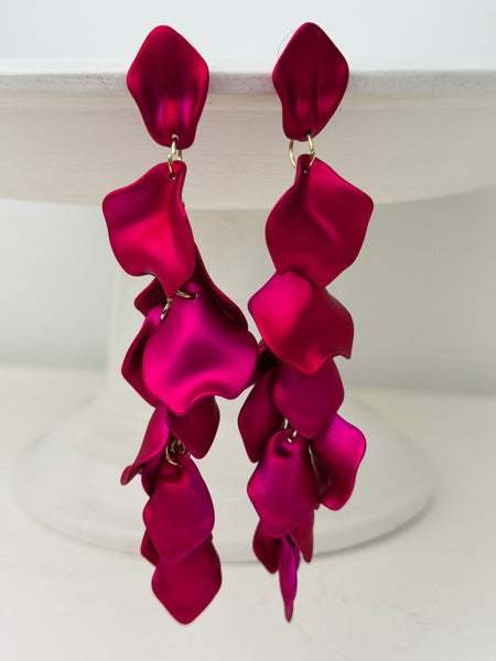 12 cm long statement drop earrings with cascading matte fuchsia acrylic petals and gold-tone metal accents.