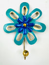 Handmade turquoise and blue flower-shaped metal wall hook with gold detailing.