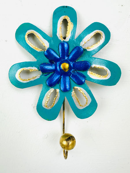 Handmade turquoise and blue flower-shaped metal wall hook with gold detailing.