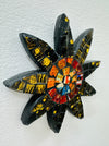 A handmade and hand painted mosaic glass daisy flower on a mdf base.