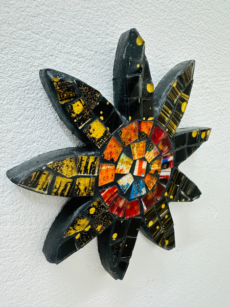 A handmade and hand painted mosaic glass daisy flower on a mdf base.