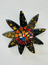 A handmade and hand painted mosaic glass daisy flower on a mdf base.