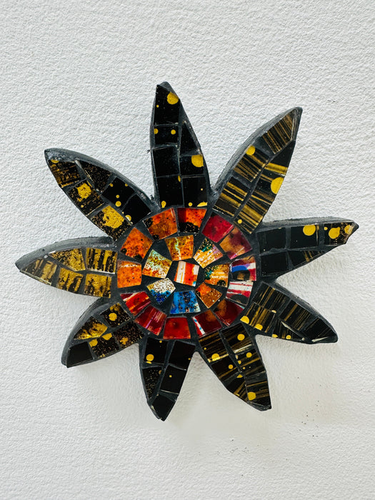 A handmade and hand painted mosaic glass daisy flower on a mdf base.