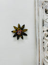 A handmade and hand painted mosaic glass daisy flower on a mdf base.
