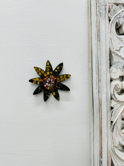 A handmade and hand painted mosaic glass daisy flower on a mdf base.
