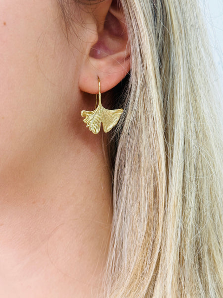 Gold leaf-shaped earring.