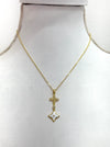 elegant gold necklace with crystal cross detail and enamel  on a mannequin bust.