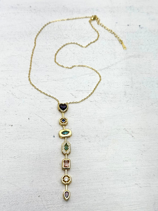 gold multi gemstone drop necklace featuring colourful stones in a vintage-inspired design.