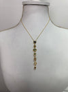 front of gold multi gemstone drop necklace featuring colourful stones in a vintage-inspired design.