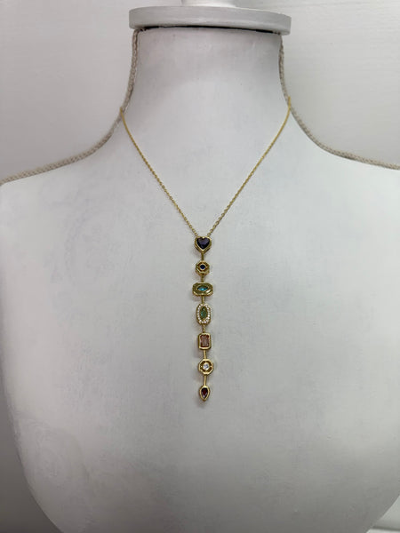 front of gold multi gemstone drop necklace featuring colourful stones in a vintage-inspired design.