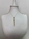 gold multi gemstone drop necklace featuring colourful stones in a vintage-inspired design.