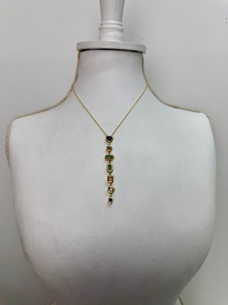 gold multi gemstone drop necklace featuring colourful stones in a vintage-inspired design.
