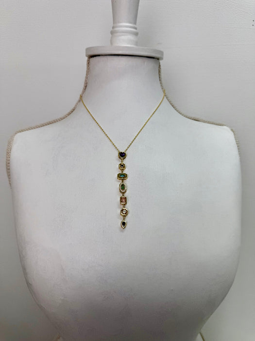 gold multi gemstone drop necklace featuring colourful stones in a vintage-inspired design.