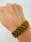 close-up of beaded gold-tone bracelet