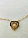 close-up of gold heart pendant