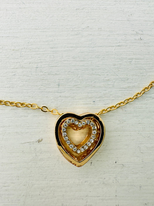 close-up of gold heart pendant