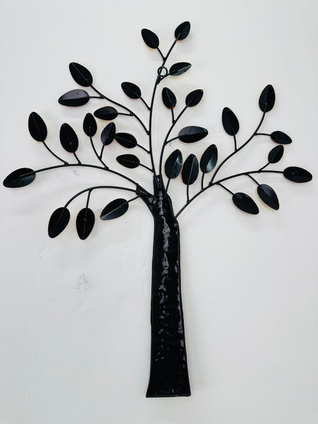 Back of metal tree wall art on a white background