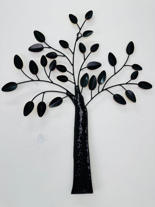 Back of metal tree wall art on a white background