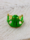 Green enamel frog adjustable ring with gold-tone details, displayed on a white background.