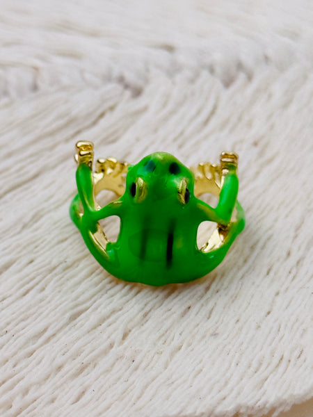 Green enamel frog adjustable ring with gold-tone details, displayed on a white background.