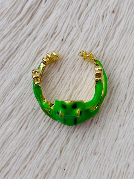 Green enamel frog adjustable ring with gold-tone details, displayed on a white background.