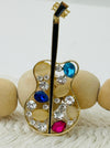 gold guitar brooch with multicolour crystal stones