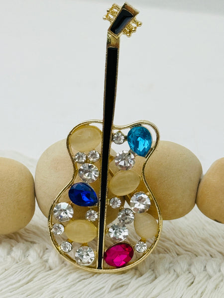 gold guitar brooch with multicolour crystal stones