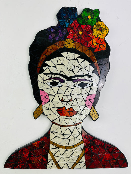 A mosaic glass portrait of Frida Kahlo with geometric patterns in various colors, predominantly featuring red, blue, and yellow, against a white background.