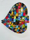 A colorful mosaic in the shape of an angel fish with various geometric patterns and gold accents.