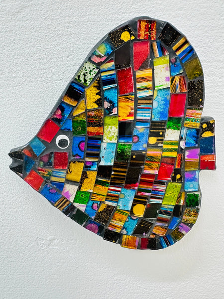 A colorful mosaic in the shape of an angel fish with various geometric patterns and gold accents.