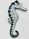 A mosaic glass seahorse with white and turquoise colors, handcrafted and hand painted on MDF base