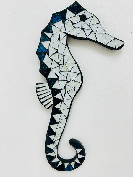A mosaic glass seahorse with white and turquoise colors, handcrafted and hand painted on MDF base