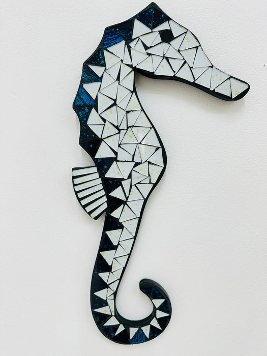 A mosaic glass seahorse with white and turquoise colors, handcrafted and hand painted on MDF base