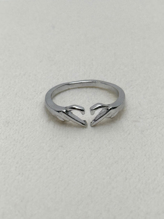 silver tone open ring with hands forming a heart shape on white background