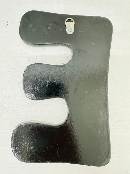 back of letter 'E' on a white background